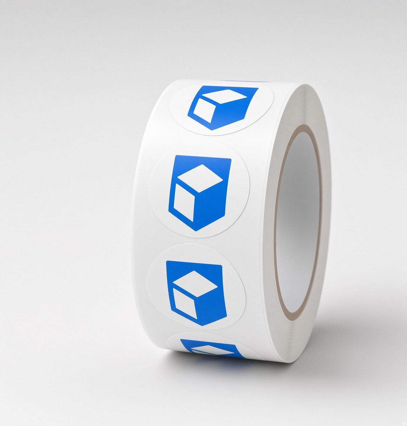 Roll of round labels printed with the Fampack cube mark