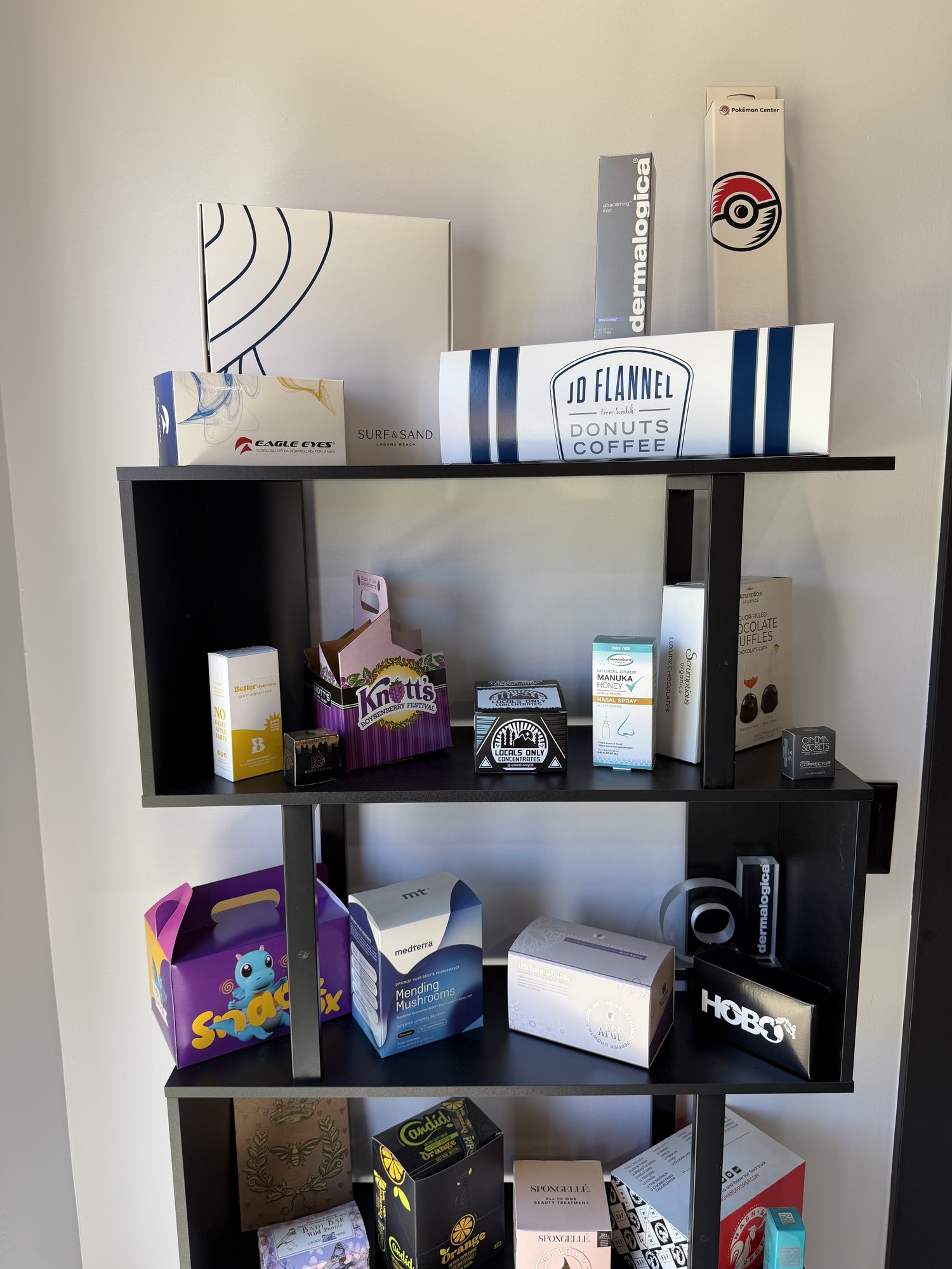Sample cartons on the shelf at the Fampack Canyon Lake office